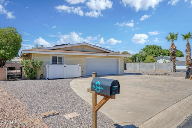 single story home with roof mounted solar panels and fence