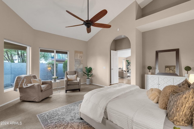 carpeted bedroom with high vaulted ceiling and ceiling fan