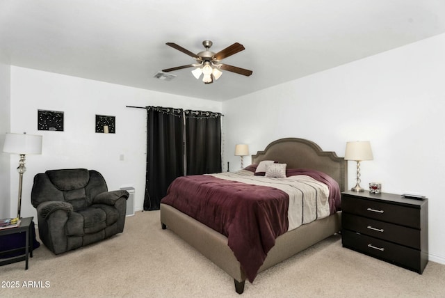 bedroom with light colored carpet, visible vents, and ceiling fan