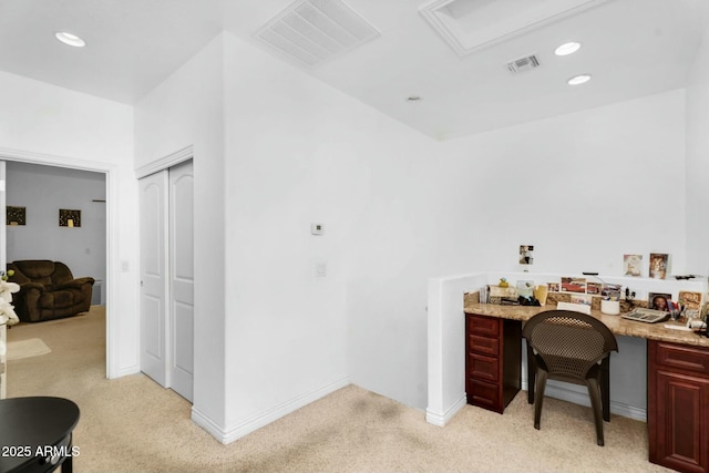 office space with visible vents, light carpet, built in desk, recessed lighting, and baseboards