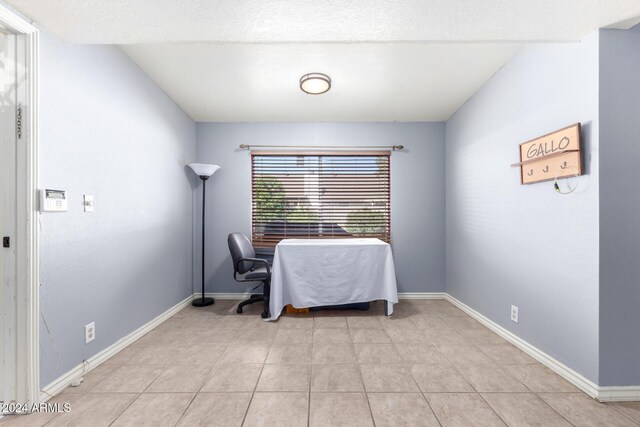 dining room with light tile patterned flooring