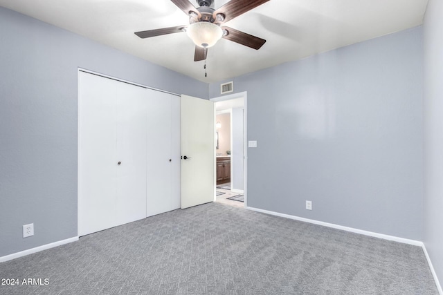 unfurnished bedroom with ceiling fan, a closet, and carpet floors