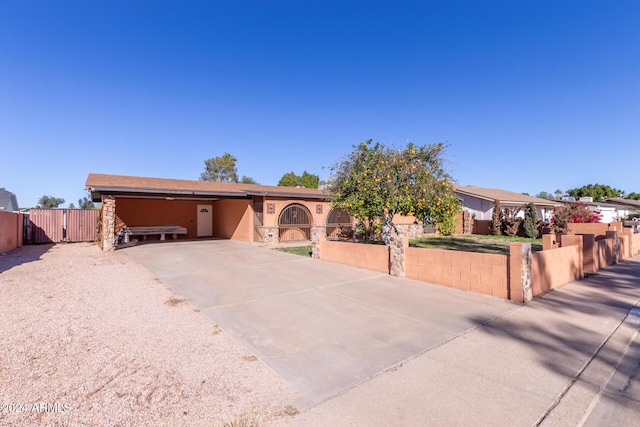 view of front of property featuring a carport