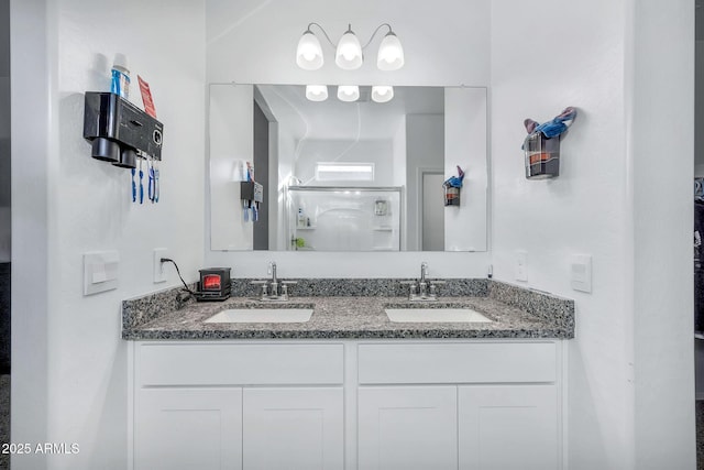 bathroom with a shower with door and vanity