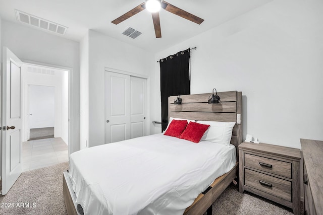 bedroom featuring carpet, a closet, and ceiling fan