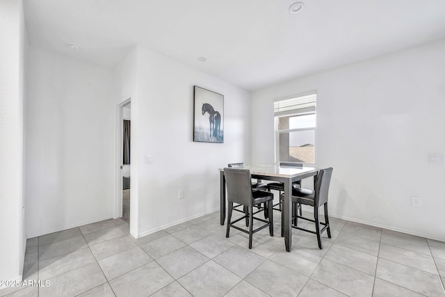 dining space with light tile patterned floors