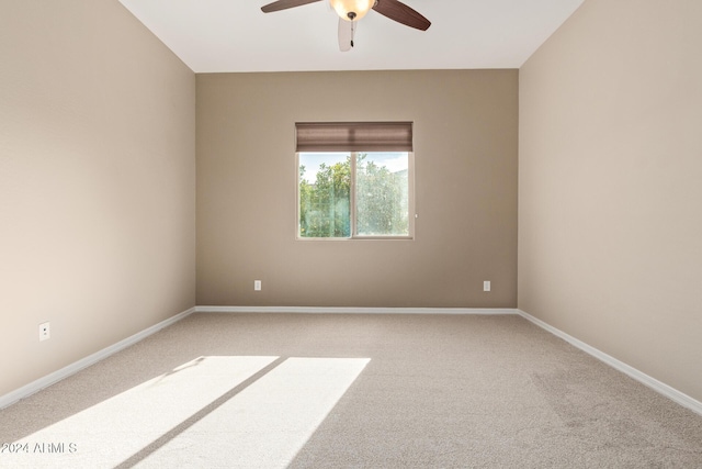 spare room with carpet flooring and ceiling fan