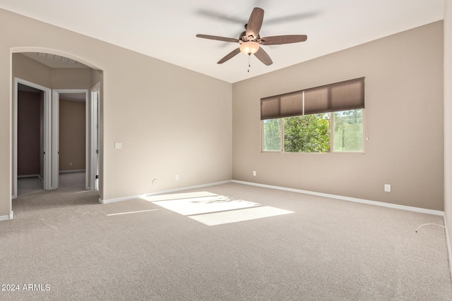 unfurnished room with light carpet and ceiling fan