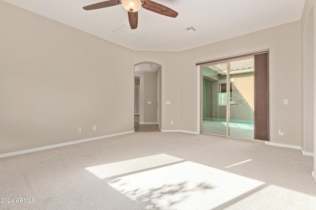 empty room featuring carpet flooring and ceiling fan