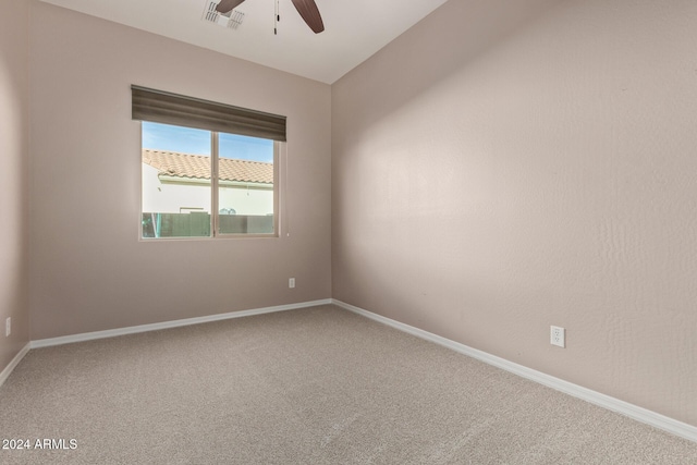 carpeted empty room with ceiling fan