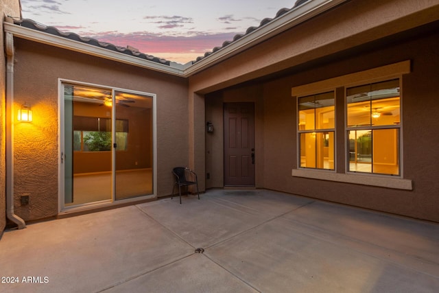 view of patio terrace at dusk