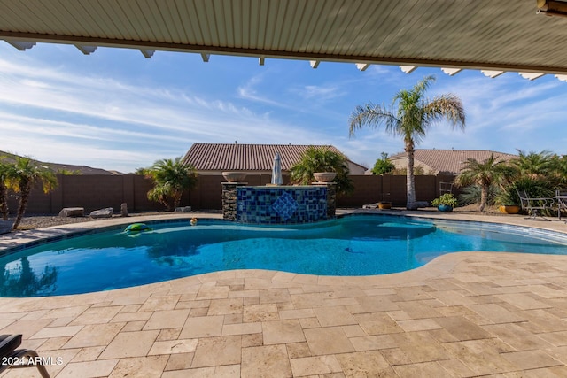 view of swimming pool with a patio area