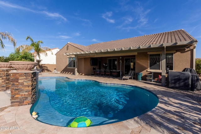 view of swimming pool featuring a patio area