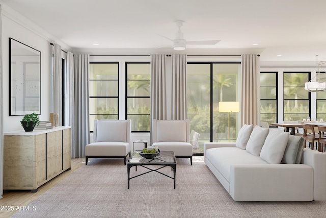 living room featuring ceiling fan and light wood-type flooring