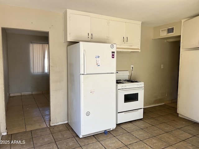 kitchen featuring visible vents, white cabinetry, tile patterned flooring, white appliances, and under cabinet range hood