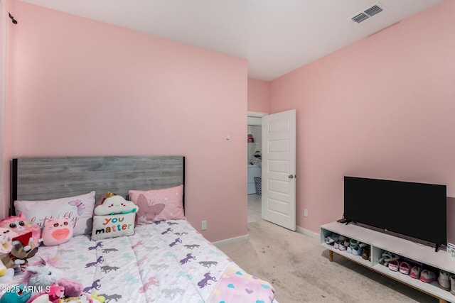 carpeted bedroom with baseboards