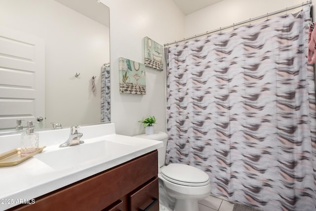 bathroom with toilet, vanity, tile patterned floors, and a shower with curtain