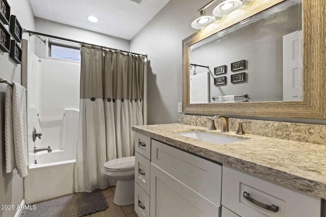 full bathroom with vanity, tile patterned floors, toilet, and shower / bath combo with shower curtain