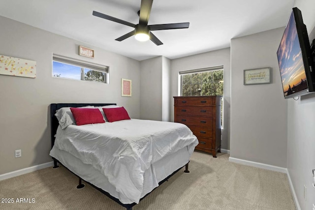 bedroom with light carpet and ceiling fan