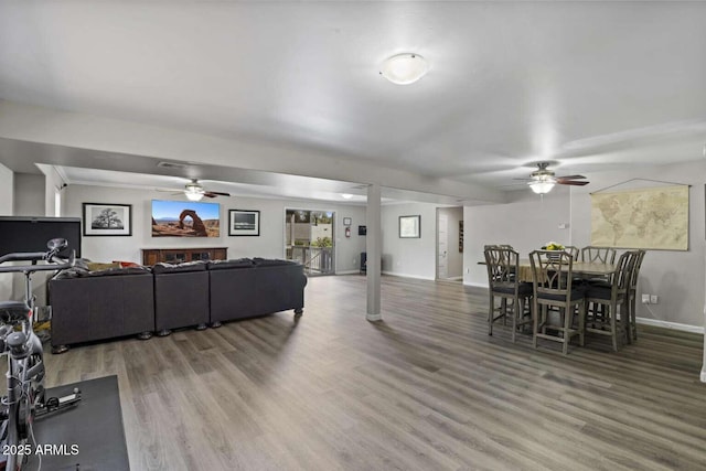 living room with hardwood / wood-style floors and ceiling fan