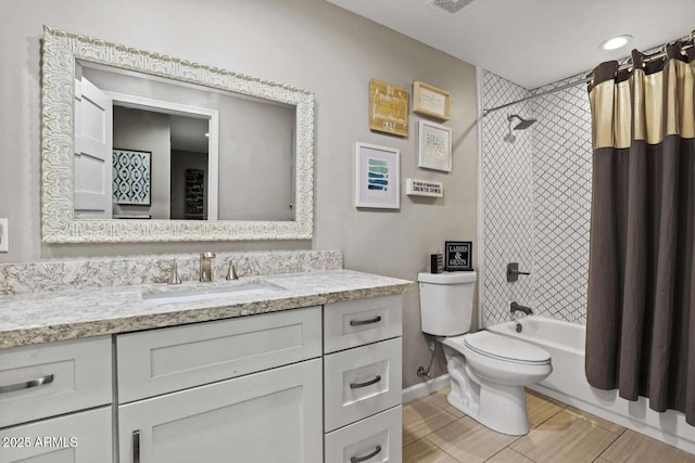 full bathroom featuring vanity, toilet, and shower / tub combo with curtain