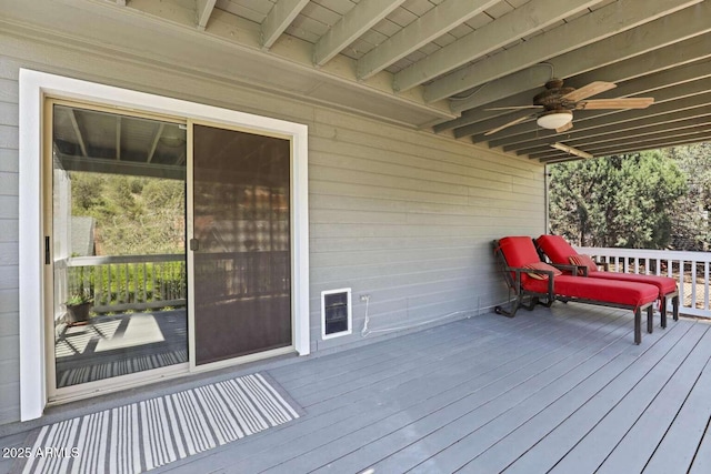 wooden terrace featuring ceiling fan