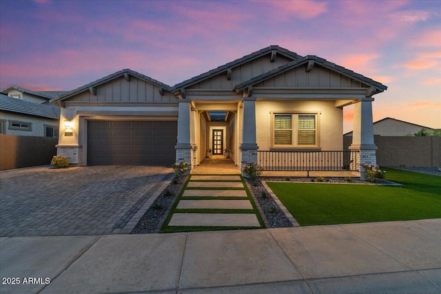 5860 E Sanford St, Mesa, AZ 85215 - craftsman-style home with board and batten siding, decorative driveway, an attached garage, a front yard, and covered porch