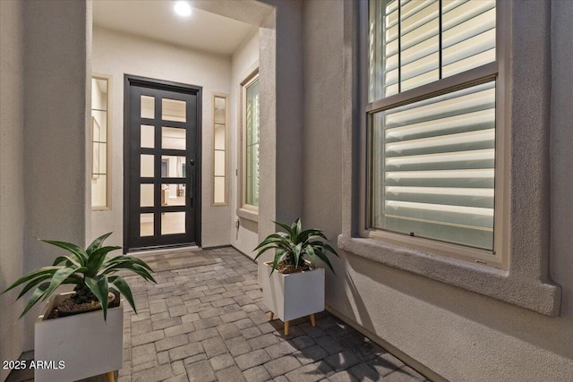 5860 E Sanford St, Mesa, AZ 85215 - entryway with brick floor, a textured wall, and baseboards