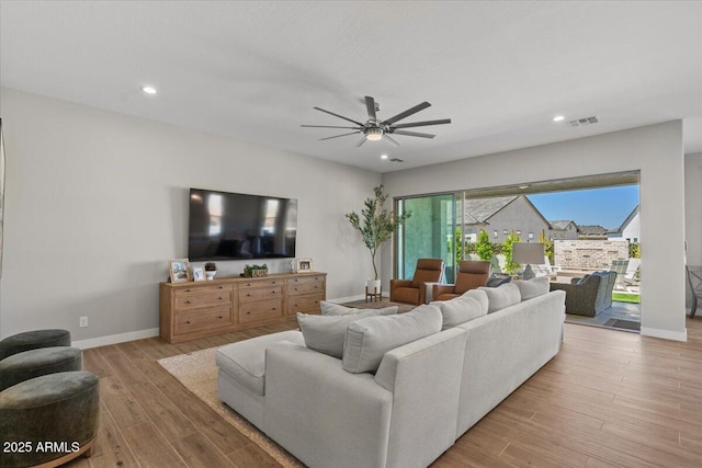 5860 E Sanford St, Mesa, AZ 85215 - living area with a ceiling fan, visible vents, recessed lighting, wood finished floors, and baseboards