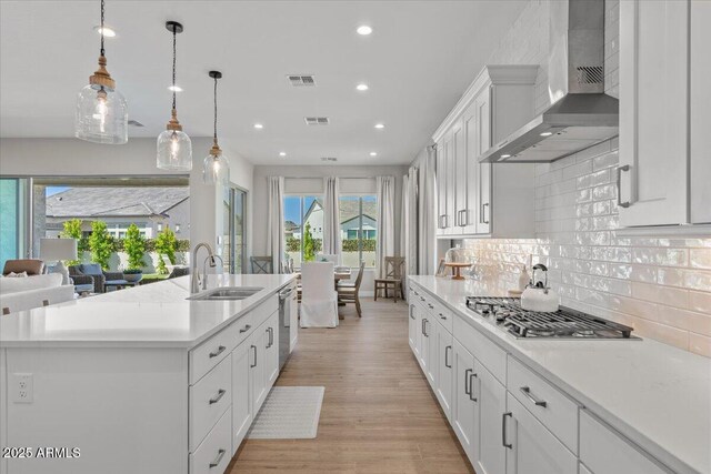 5860 E Sanford St, Mesa, AZ 85215 - kitchen with visible vents, a sink, wall chimney range hood, recessed lighting, and stainless steel appliances
