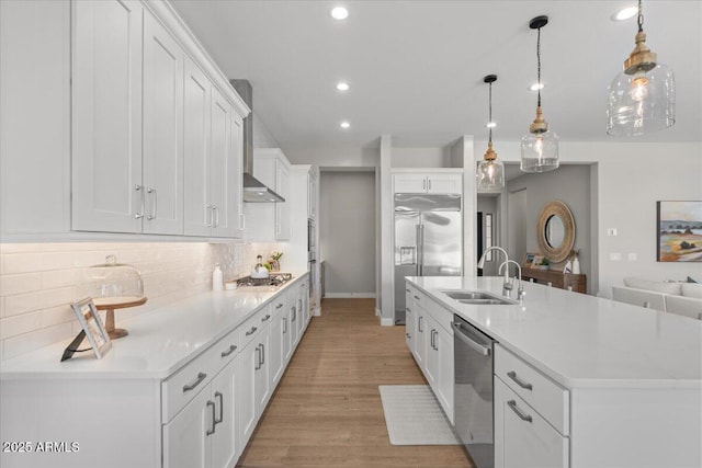 5860 E Sanford St, Mesa, AZ 85215 - kitchen featuring wall chimney exhaust hood, recessed lighting, appliances with stainless steel finishes, a sink, and backsplash