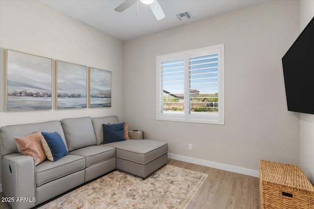 5860 E Sanford St, Mesa, AZ 85215 - living room featuring wood finished floors, ceiling fan, baseboards, and visible vents