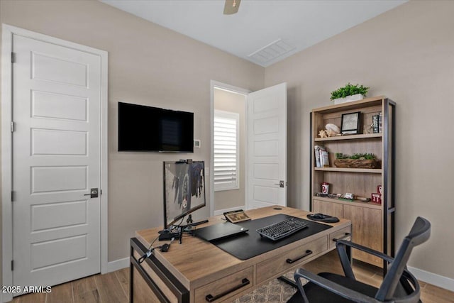 5860 E Sanford St, Mesa, AZ 85215 - office area with visible vents, baseboards, and wood finished floors