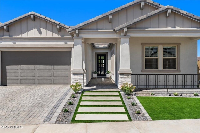 5860 E Sanford St, Mesa, AZ 85215 - craftsman inspired home with board and batten siding, a garage, stucco siding, and decorative driveway