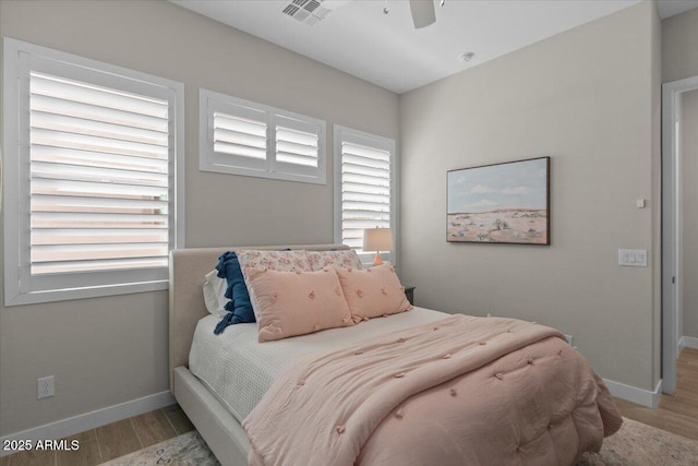 5860 E Sanford St, Mesa, AZ 85215 - bedroom with wood finished floors, baseboards, and visible vents