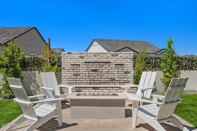 5860 E Sanford St, Mesa, AZ 85215 - view of patio / terrace with an outdoor fire pit and fence