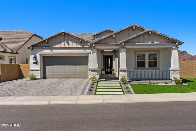 5860 E Sanford St, Mesa, AZ 85215 - craftsman house featuring a garage, fence, decorative driveway, and a tile roof
