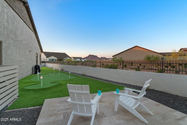 5860 E Sanford St, Mesa, AZ 85215 - patio terrace at dusk featuring a fenced backyard