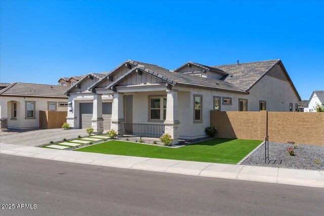 5860 E Sanford St, Mesa, AZ 85215 - craftsman house with an attached garage, stucco siding, fence, and a tile roof