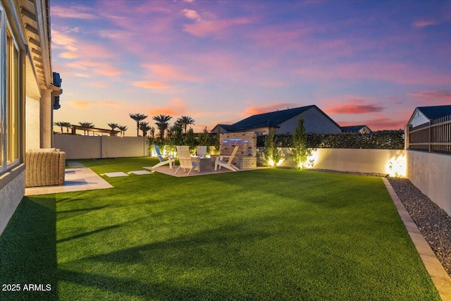 5860 E Sanford St, Mesa, AZ 85215 - yard at dusk with a patio and a fenced backyard