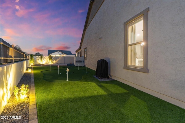 5860 E Sanford St, Mesa, AZ 85215 - yard at dusk featuring a fenced backyard