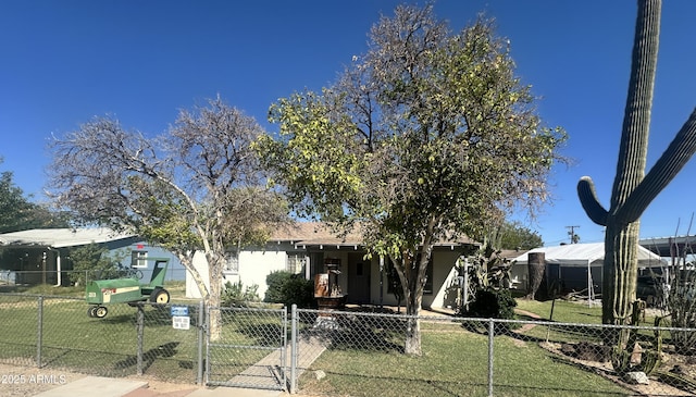 213 3rd Ave W, Buckeye, AZ 85326 - view of front facade with a fenced front yard, a gate, and stucco siding