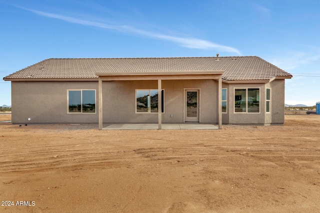 back of house with a patio area