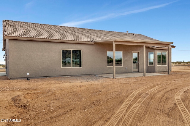 back of property with a patio area