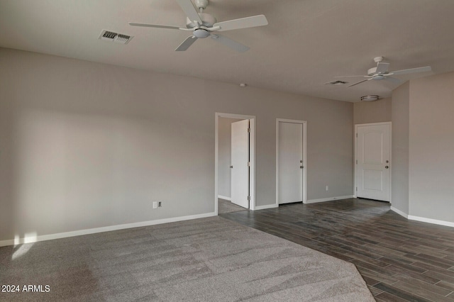 spare room with dark hardwood / wood-style floors and ceiling fan