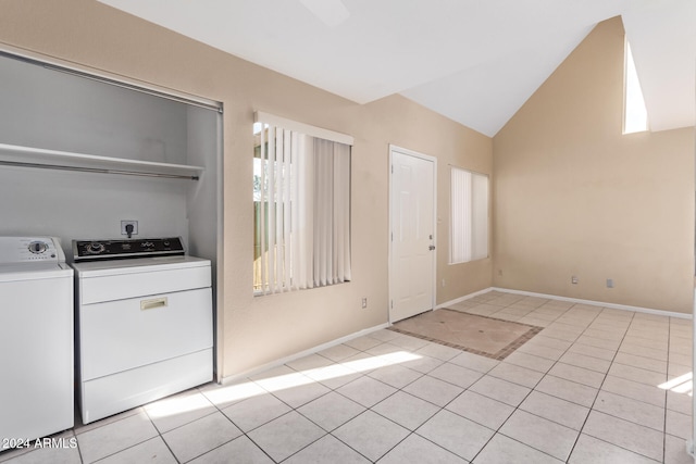 washroom featuring washer and clothes dryer and light tile patterned floors