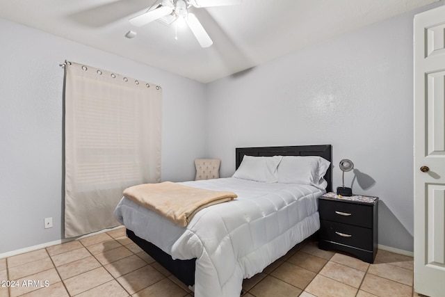 bedroom featuring ceiling fan and light tile patterned flooring