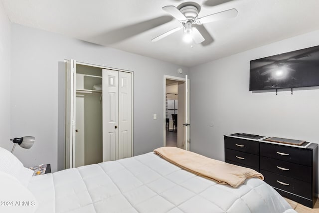 bedroom featuring ceiling fan and a closet