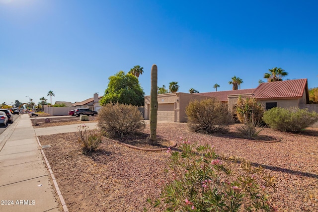 10096 N 63rd Ave, Glendale, AZ 85302 - view of front of home featuring stucco siding, an attached garage, and a tile roof