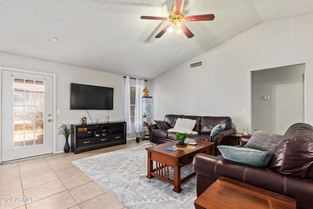 10096 N 63rd Ave, Glendale, AZ 85302 - living room featuring vaulted ceiling, a textured ceiling, ceiling fan, and light tile patterned floors